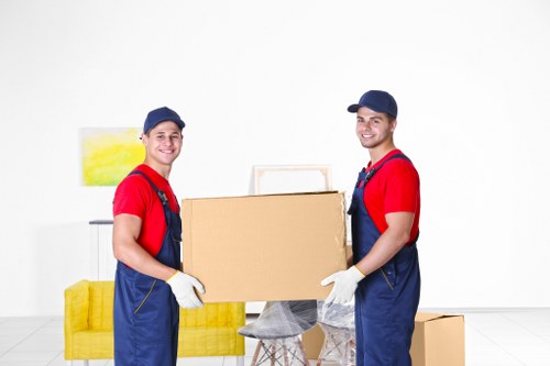 Staff and customers following safe procedures inside a storage facility