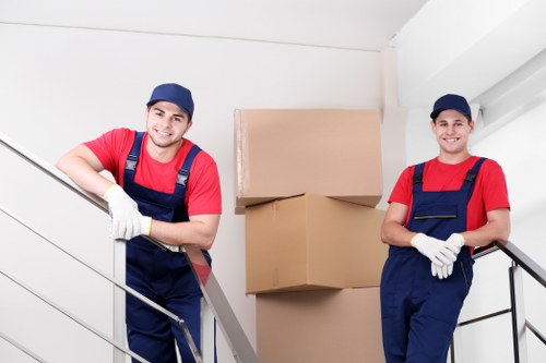 Customer confirming a Dollishill Storage booking with documents and packed boxes